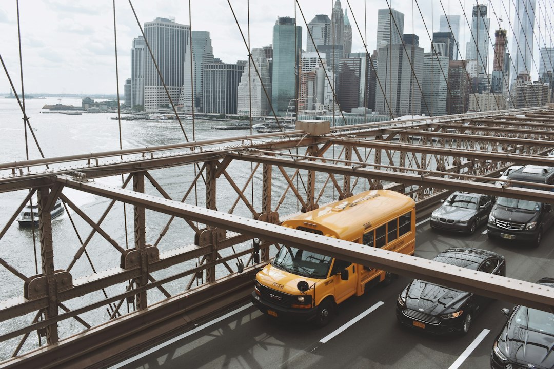 yellow van on bridge during daytime